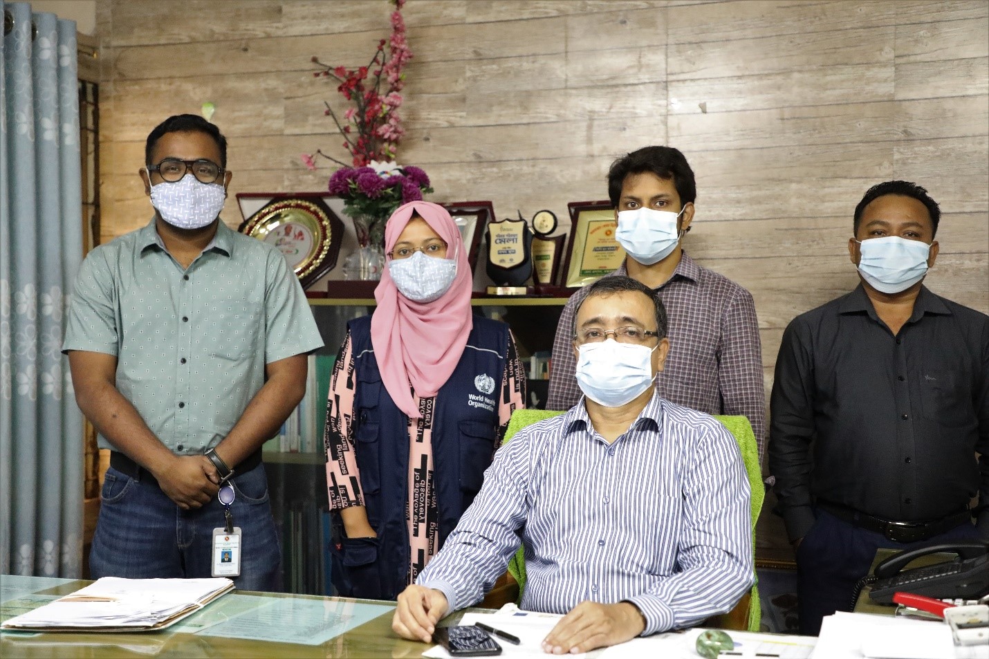 Cox's Bazar Civil Surgeon, Dr. Md Mahbubur Rahman, and the team from the Health Emergency Operations Center/Control Room, which includes Dr. Rishad Choudhury Robin, a Public Health Officer from MoHFW Coordination Cell; Dr. Umme Asma Absari, a WHO Technical Support Officer; and Dr. Shownam Barua, ISCG/ Syed Tafhim.